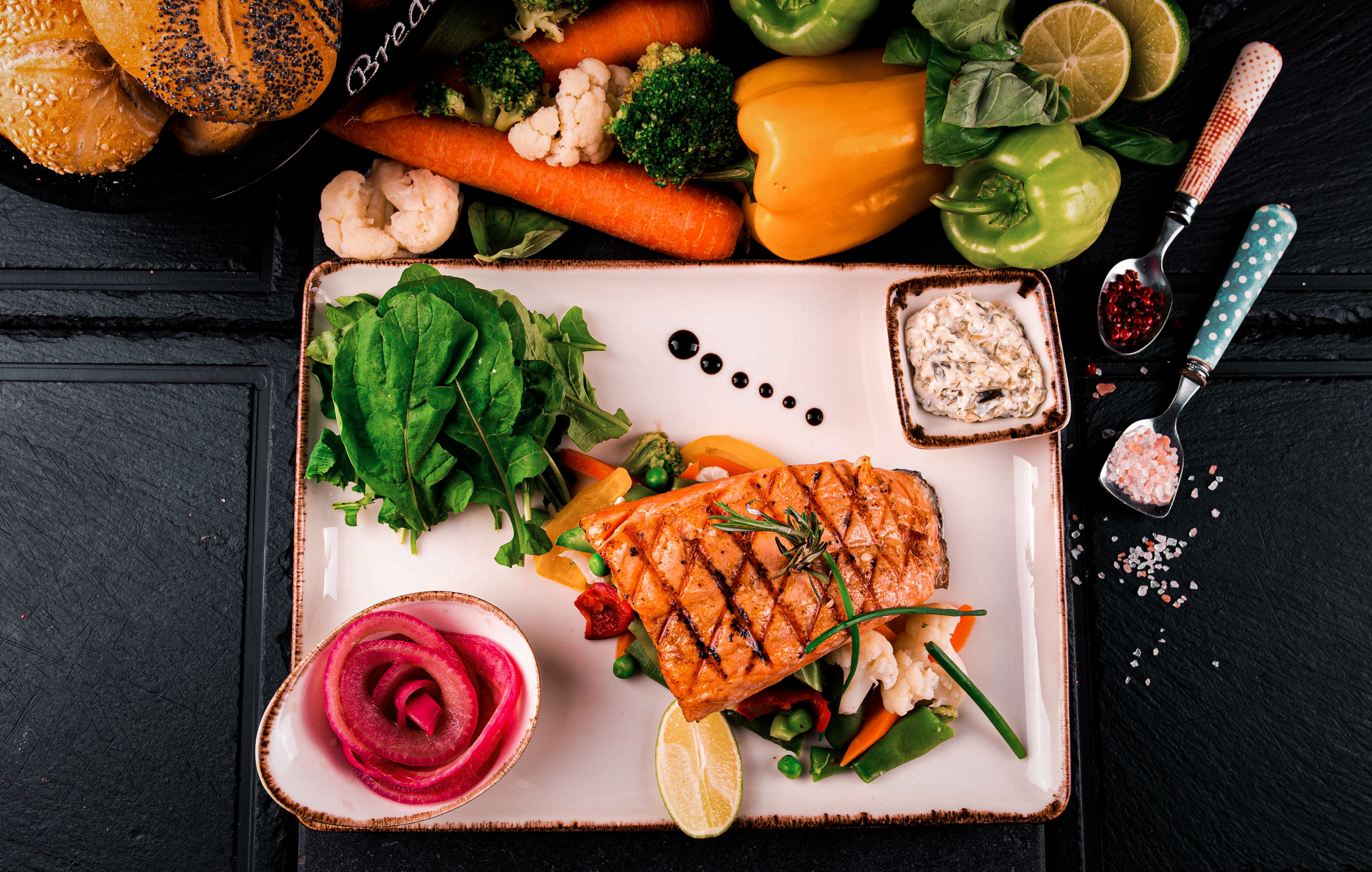 Plate of grilled salmon and sardines for omega-3 support as the best brain foods to improve memory