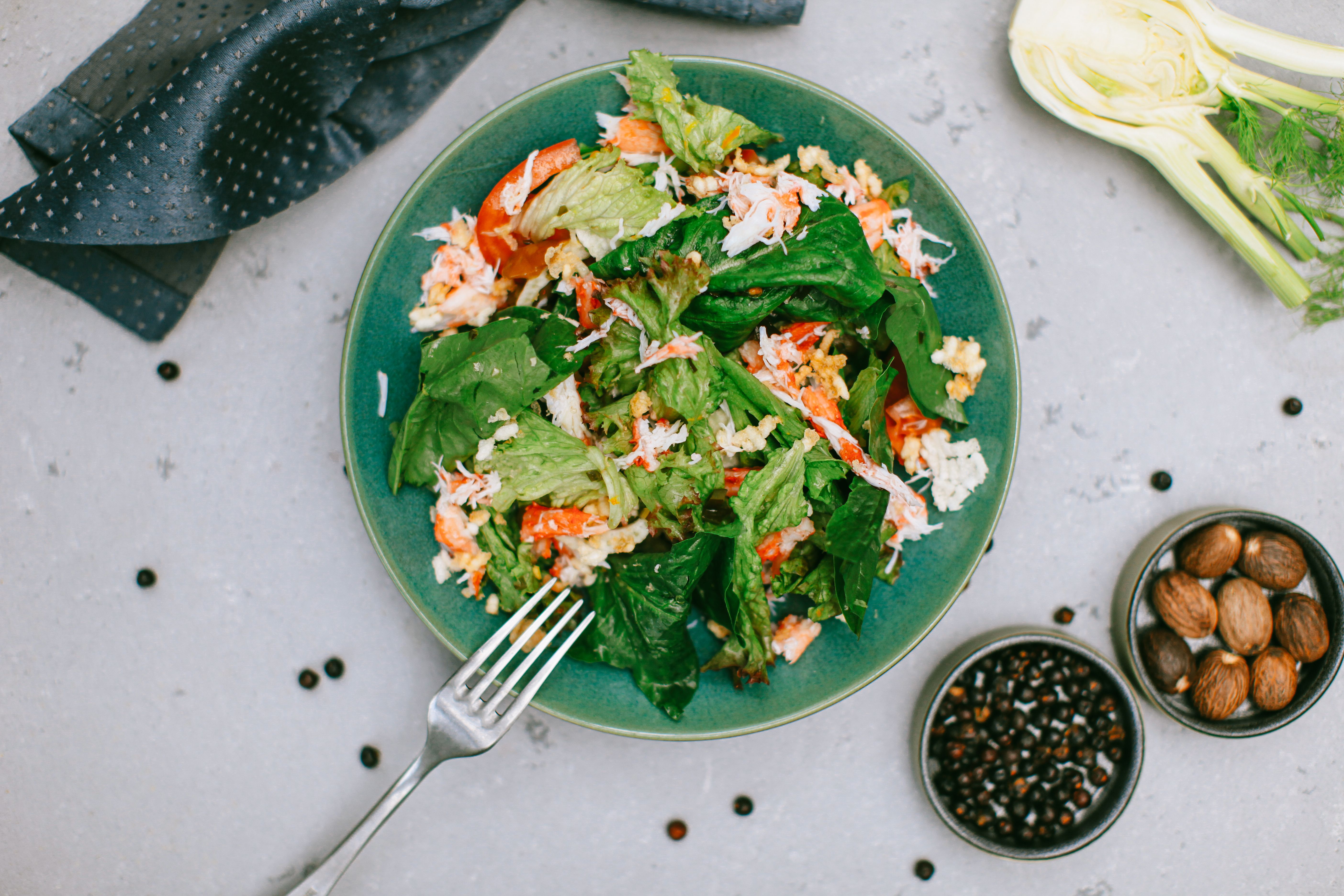 Basket of fresh spinach, kale, and collard greens as top leafy green brain foods for memory