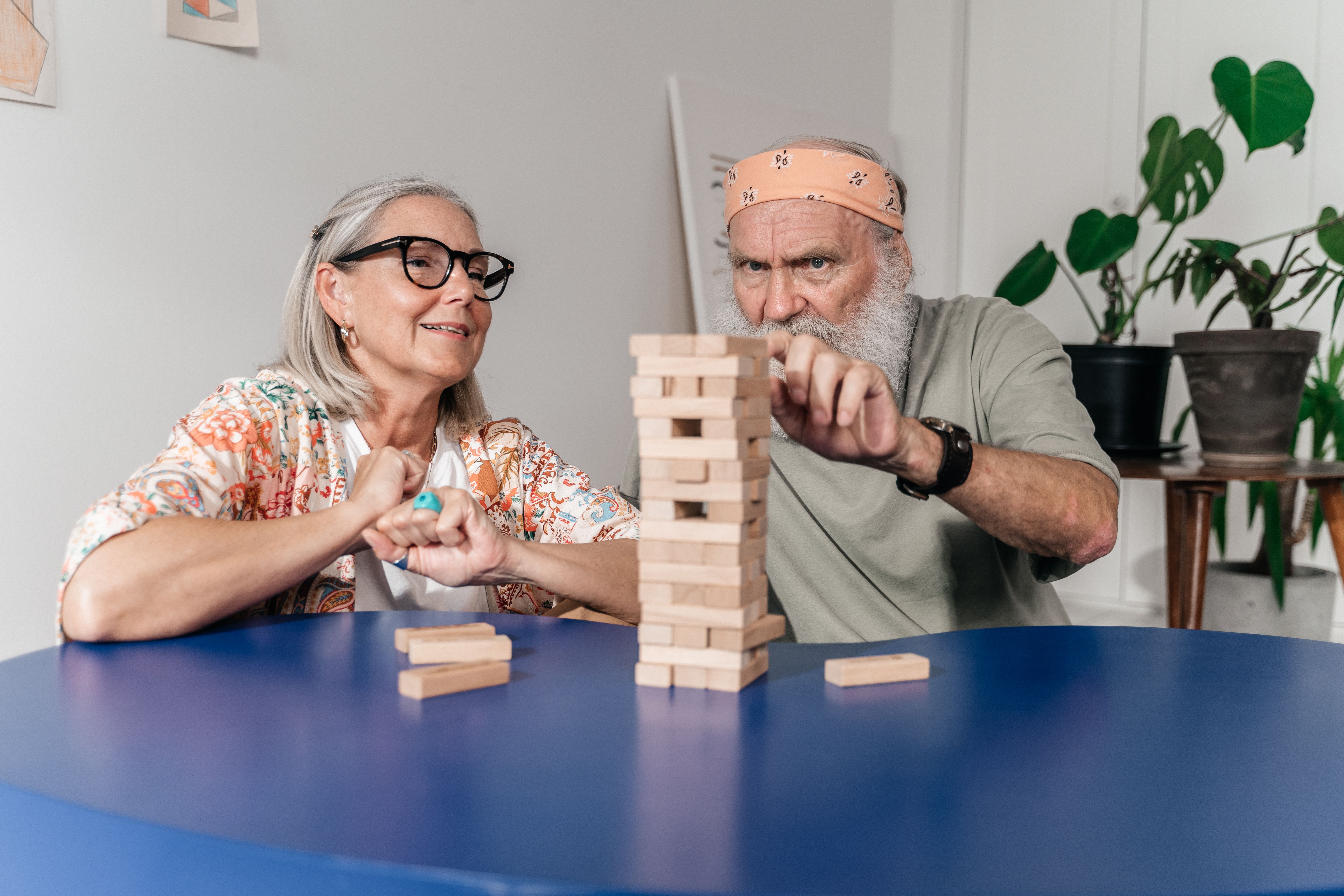 motivated senior man combining memory exercise with gentle morning stretch