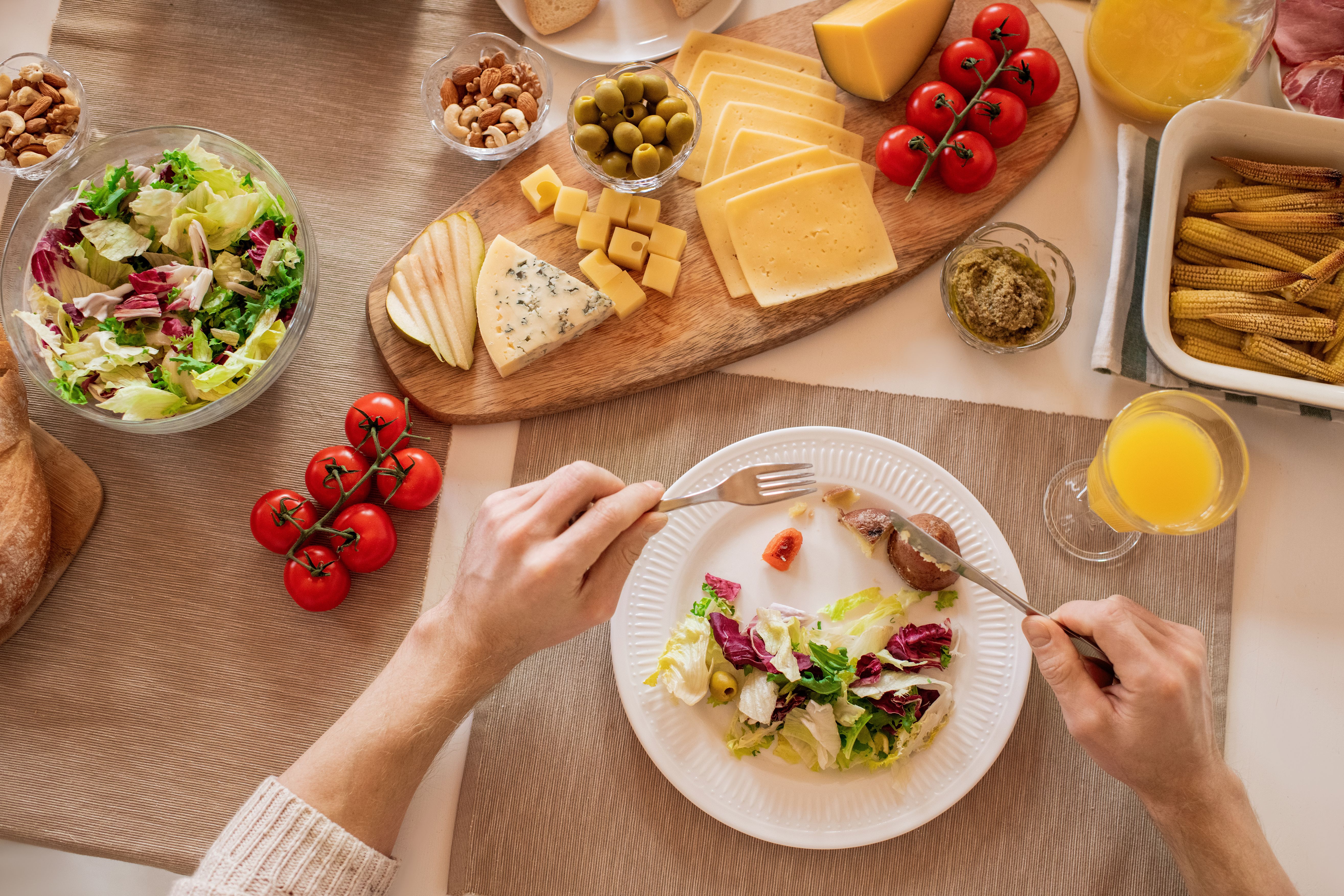 Glass bottle of extra-virgin olive oil with vegetables for brain health