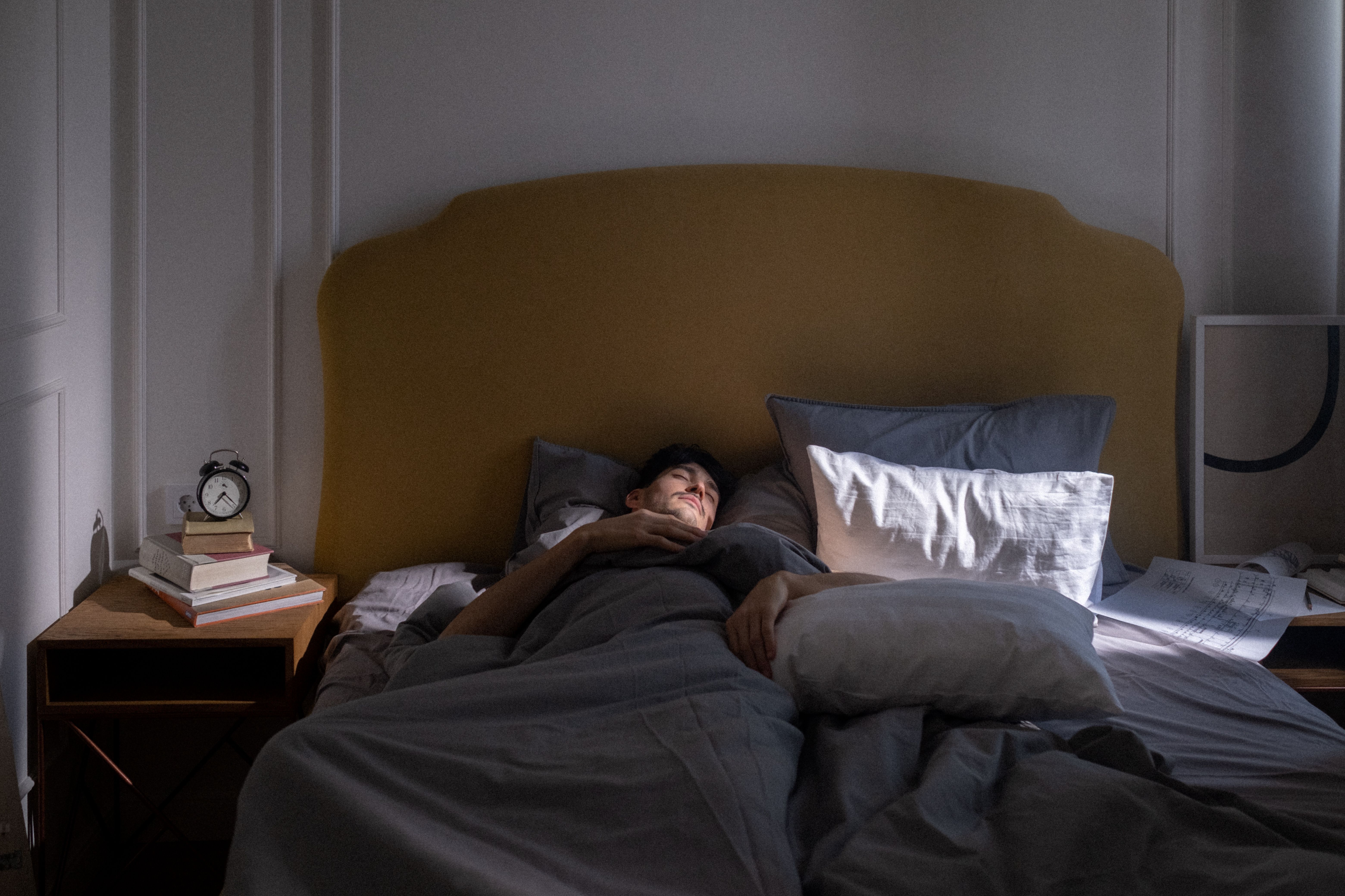 Peaceful mindfulness moment, person meditating on bed, sleep foundations guide, bedtime routine